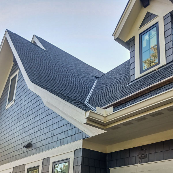 Red/Black House with Black Roofing
